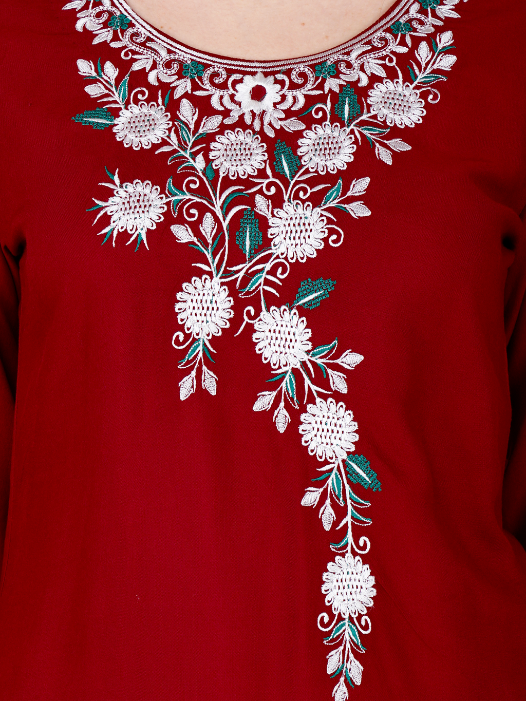 Red short kurti close-up of white floral embroidery with green and teal accents