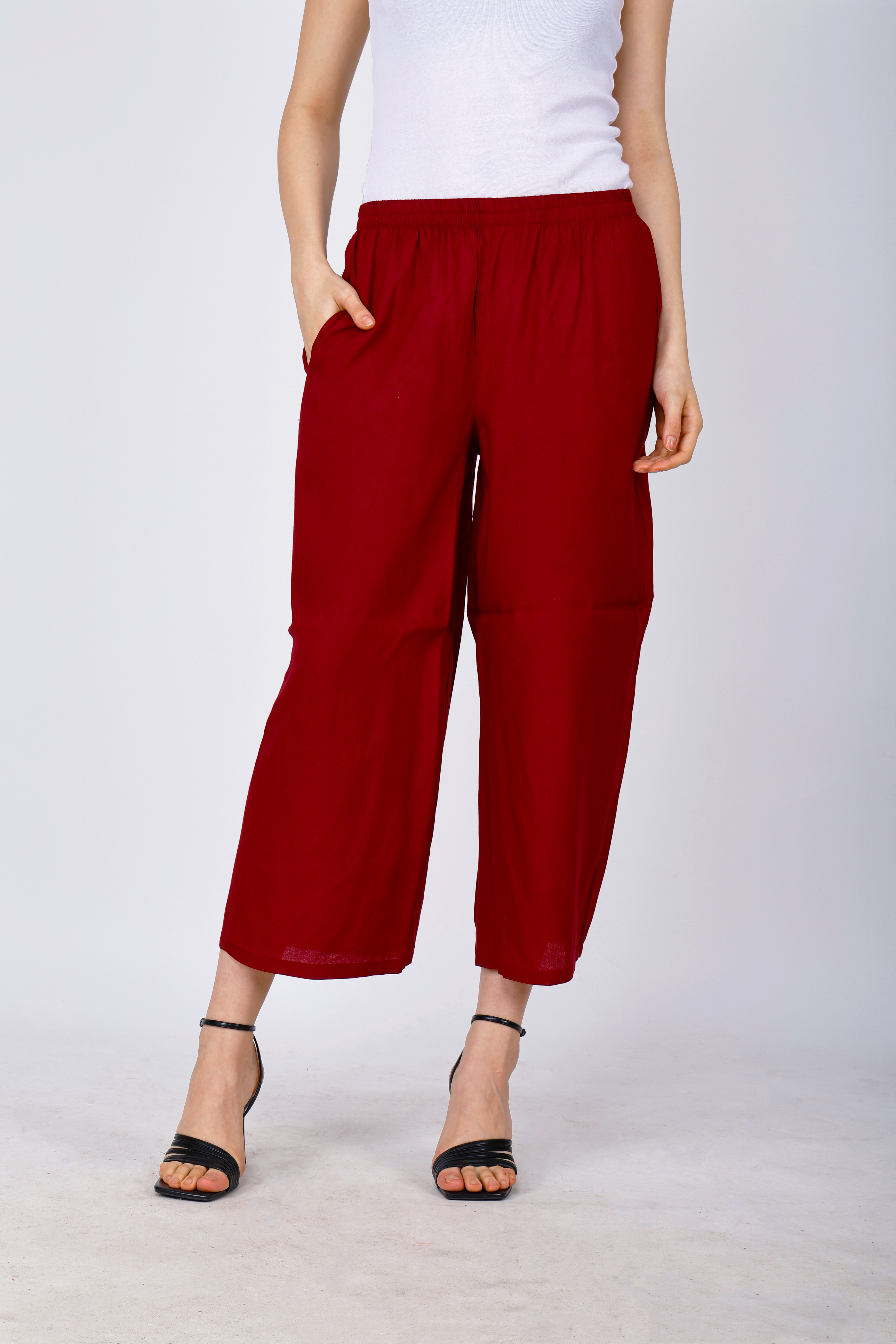 Women’s maroon palazzo pants, side view, elastic waist and wide cropped legs