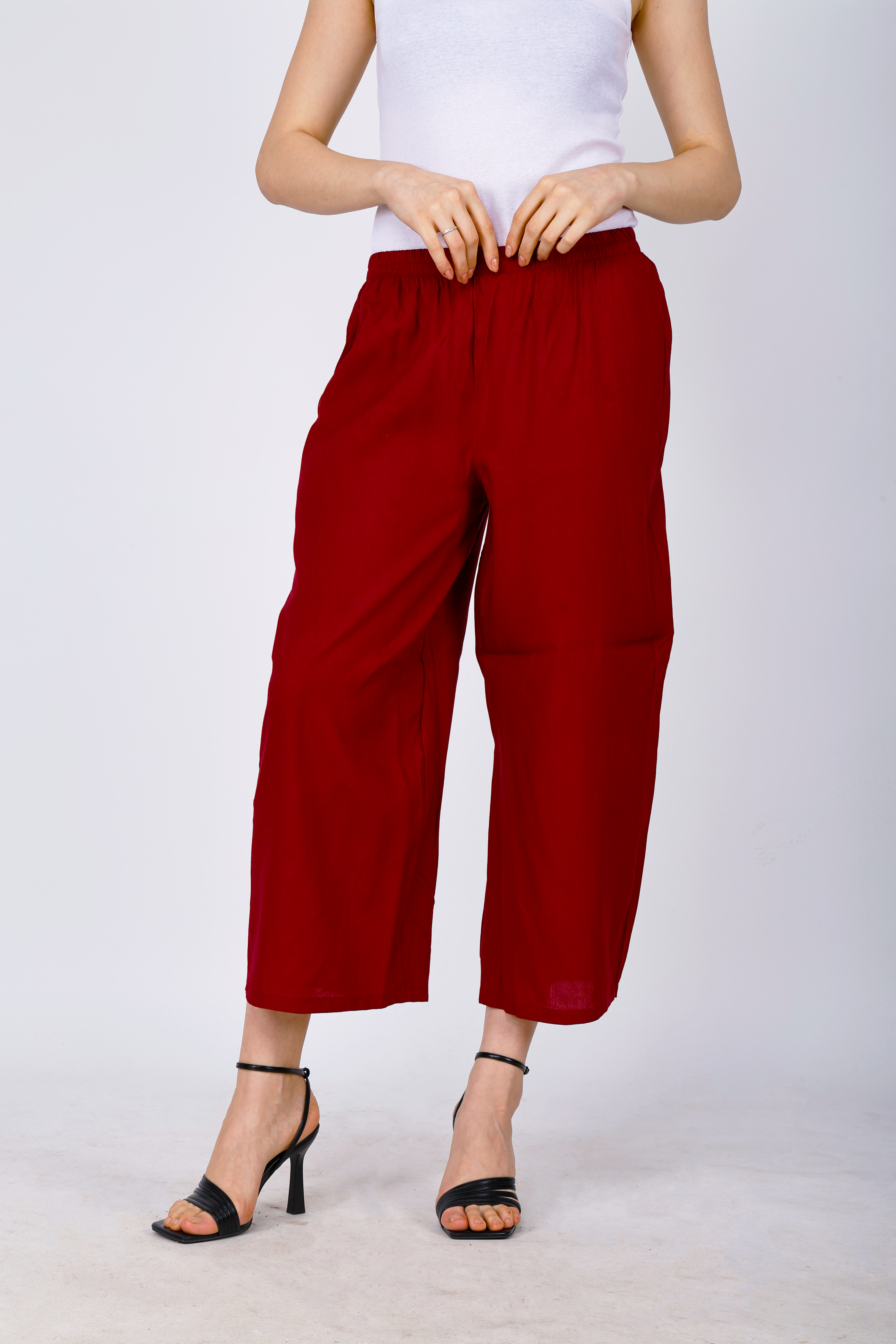 Women’s maroon palazzo pants with elastic waistband and billowy wide-leg silhouette