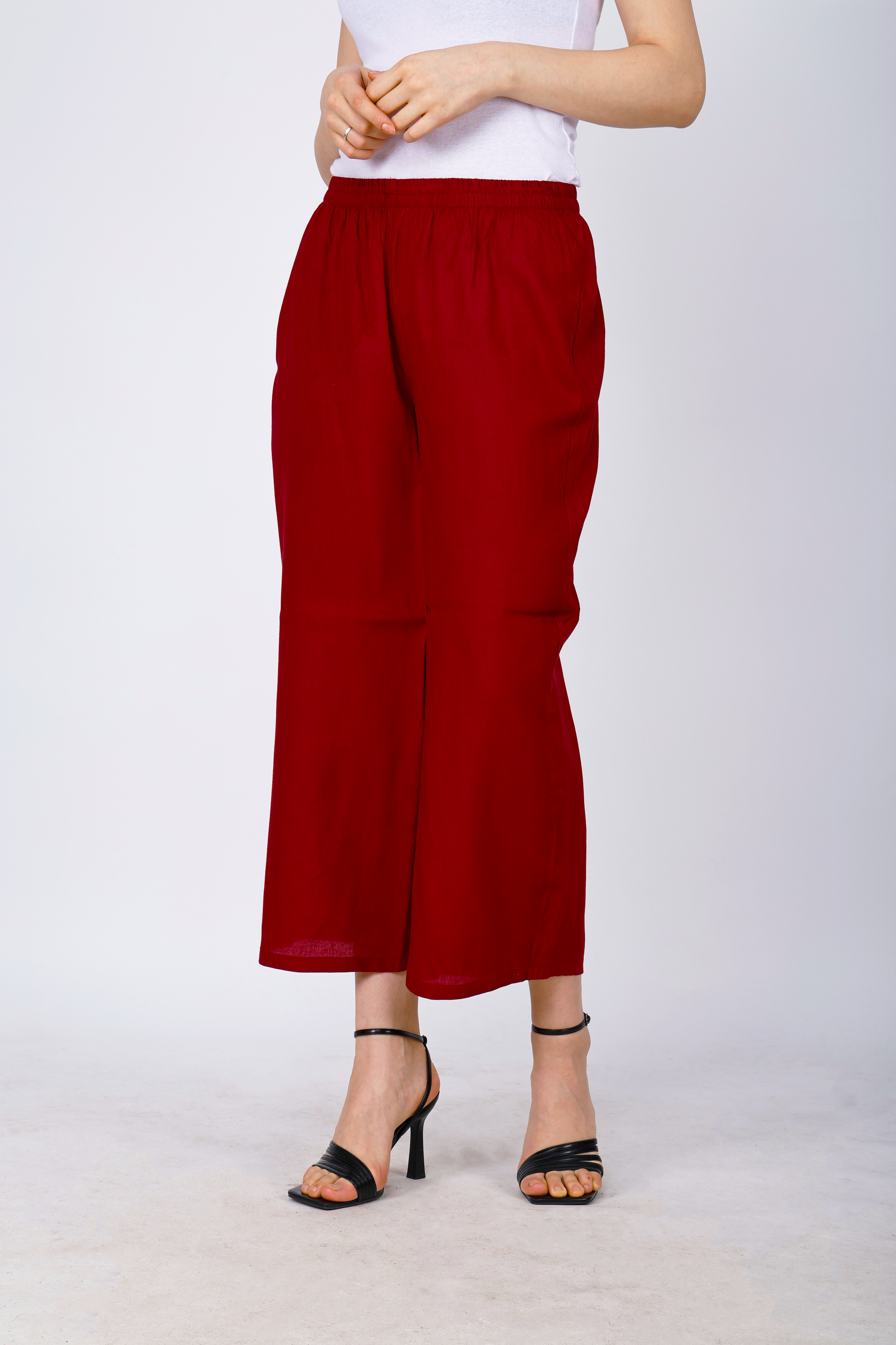 Women’s maroon palazzo pants, back view, elastic waistband and wide ankle-length cut