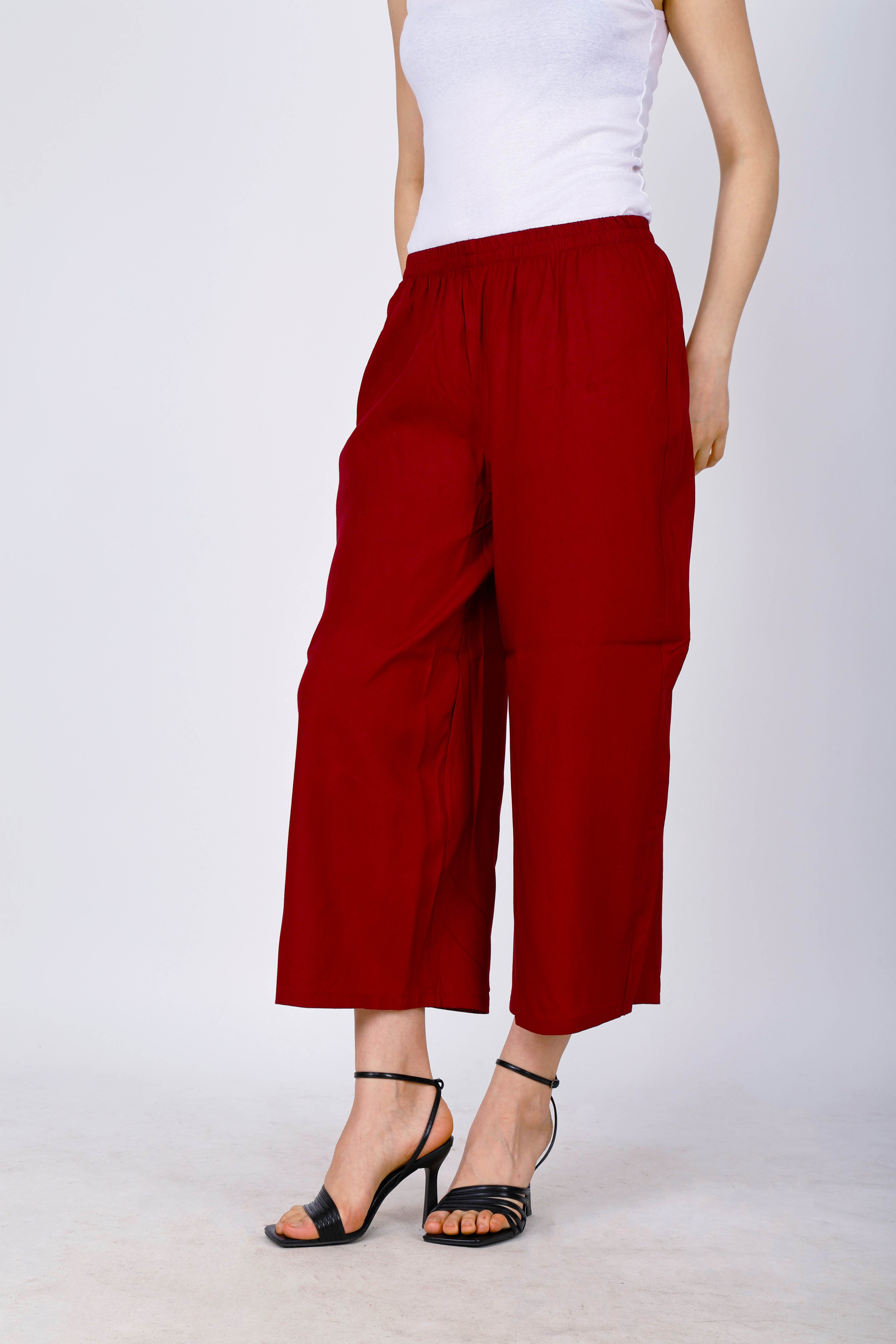 Women’s maroon palazzo pants, side view, relaxed wide legs and elastic waist