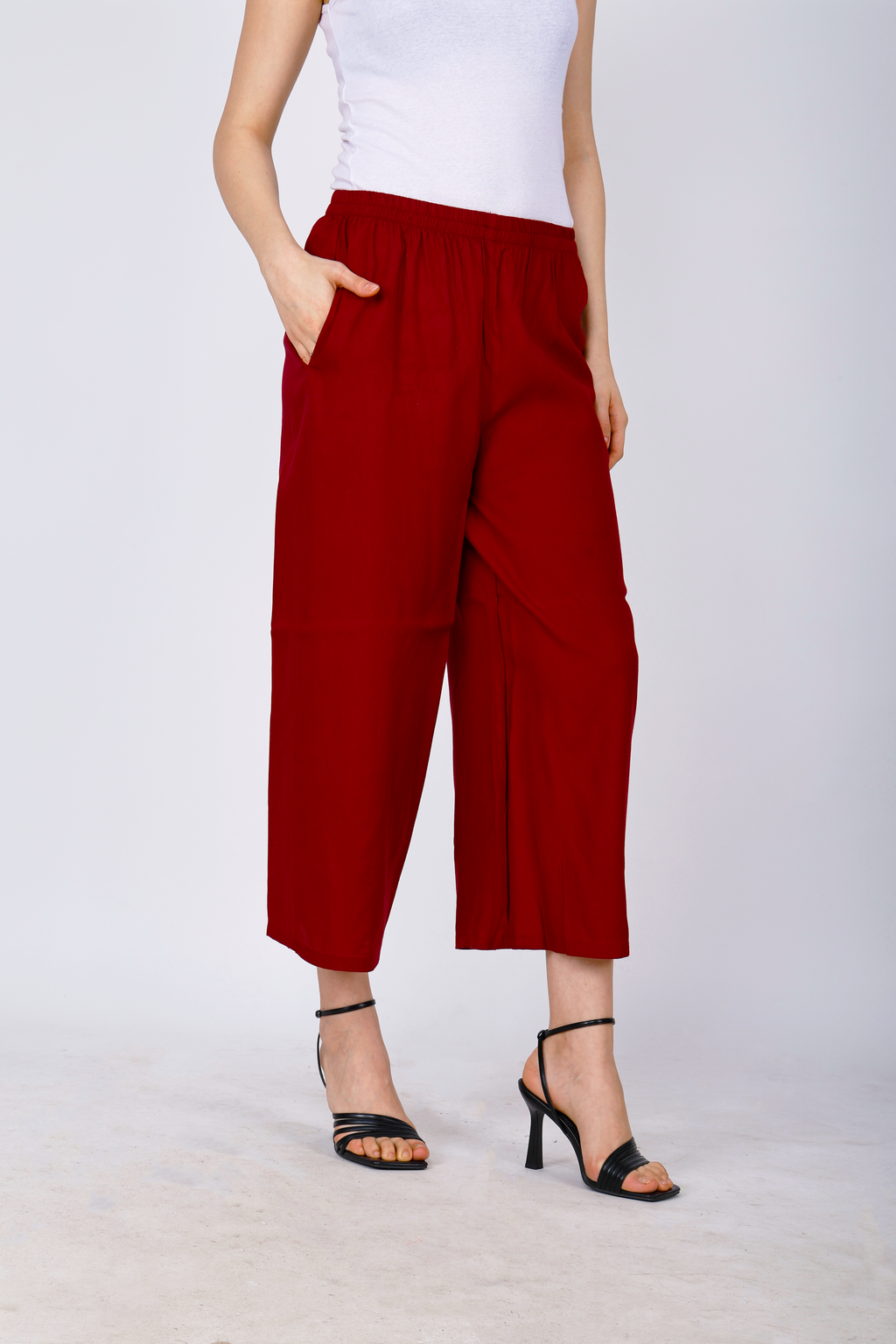 Women’s maroon palazzo pants with elastic waist and wide straight cropped legs