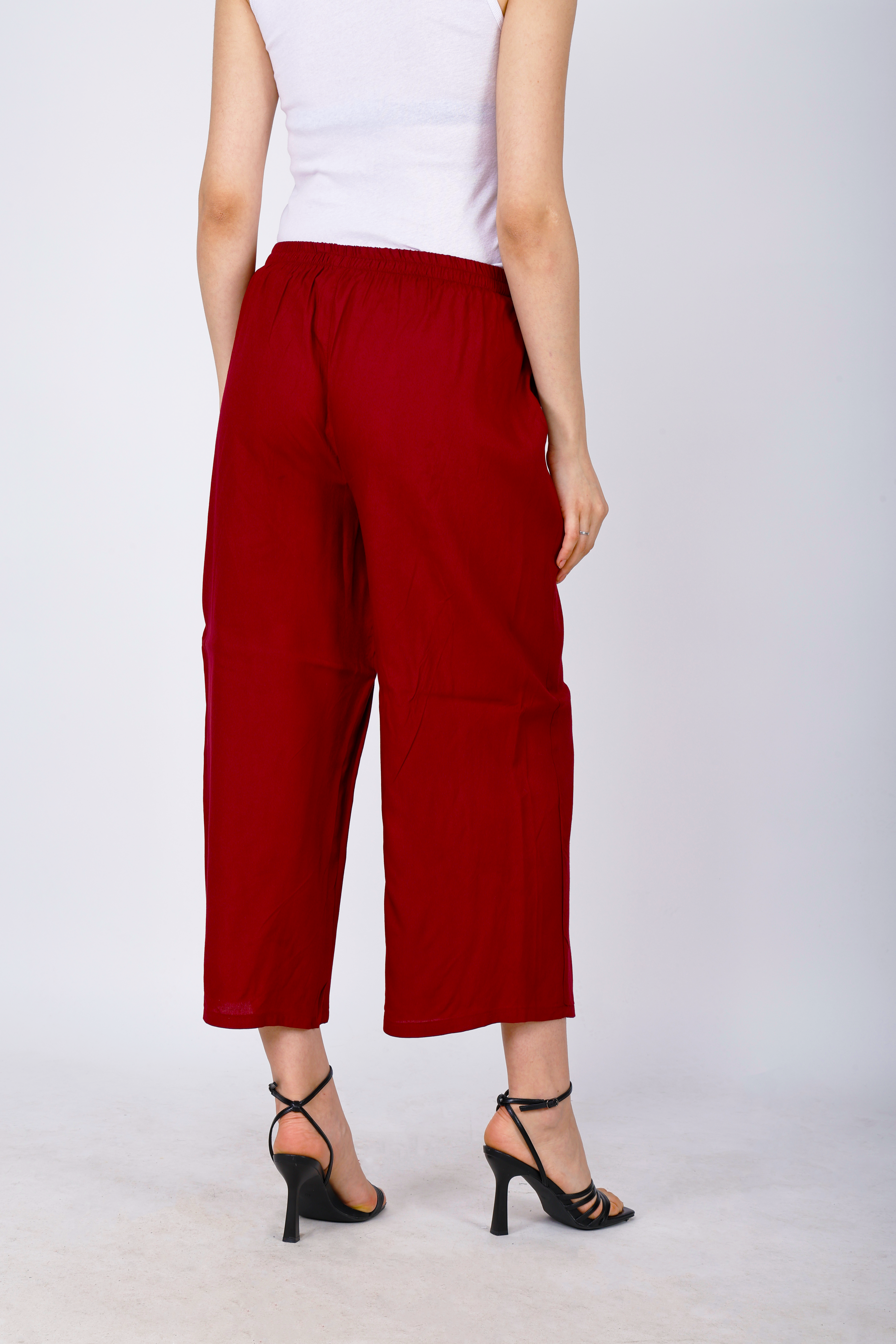 Women’s maroon palazzo pants, back view, elastic waistband with wide cropped hem
