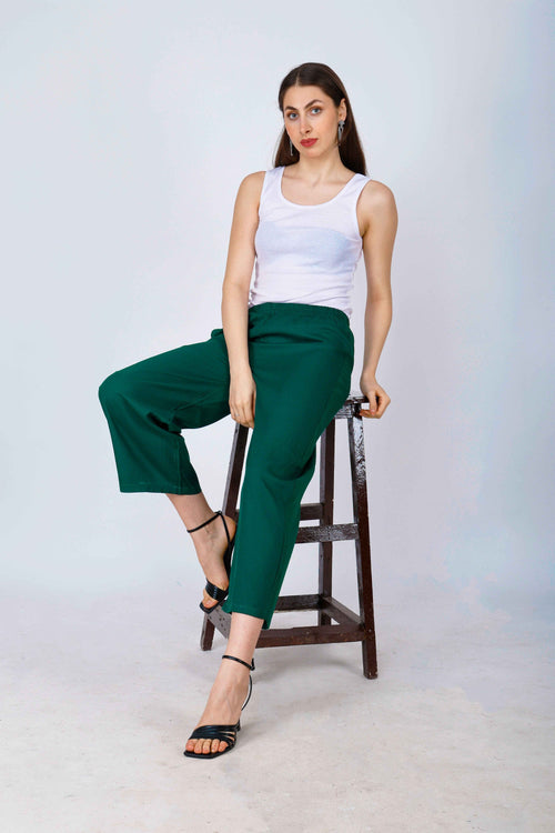 Women’s dark green palazzo pants with wide legs and elastic waistband, ankle length