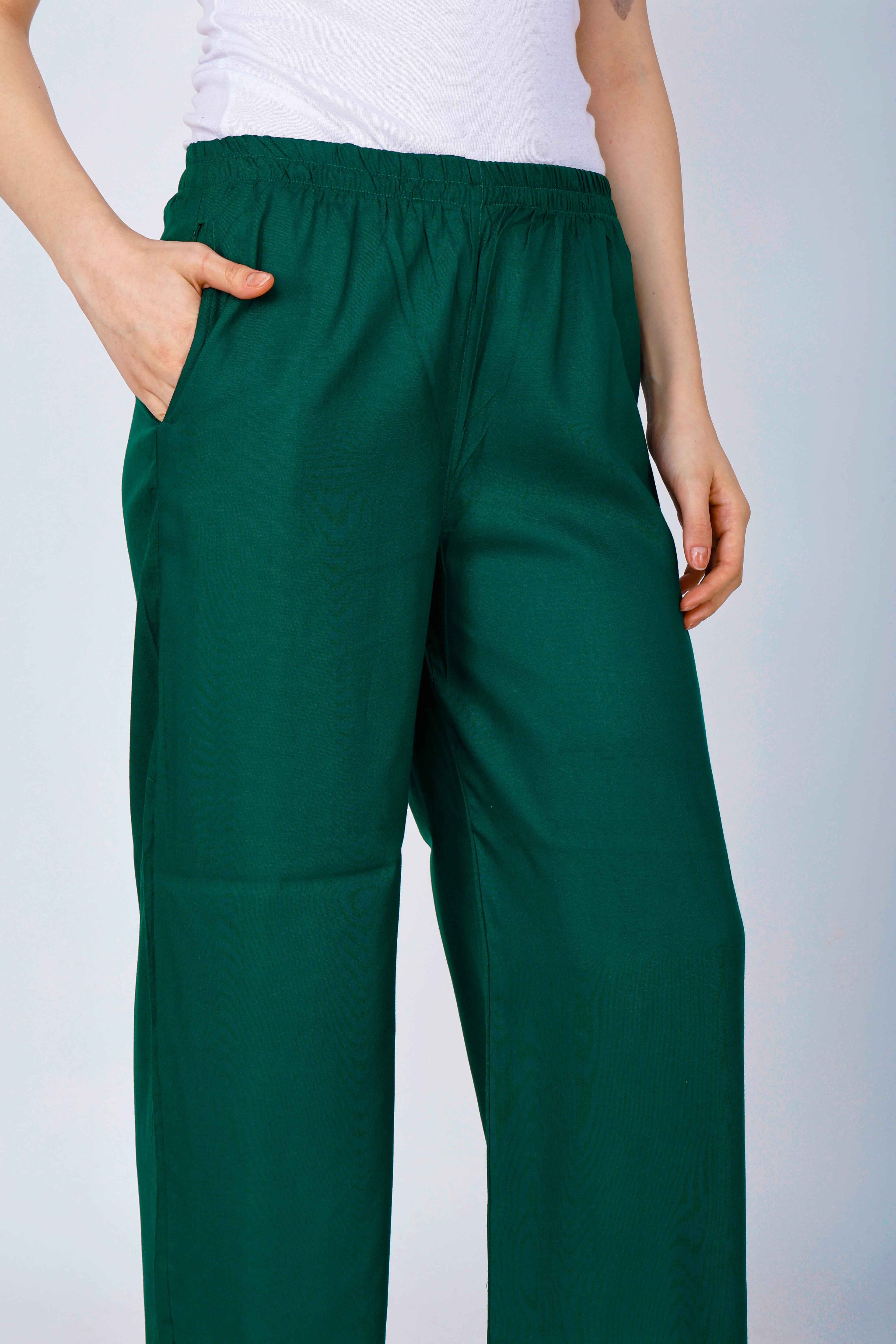 Women’s dark green palazzo pants close-up of elastic waistband and wide-leg fabric