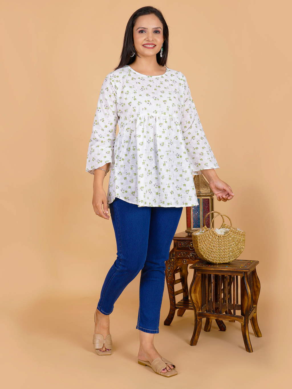 Women’s floral tunic dress in white with small green print, round neckline, 3/4 sleeves