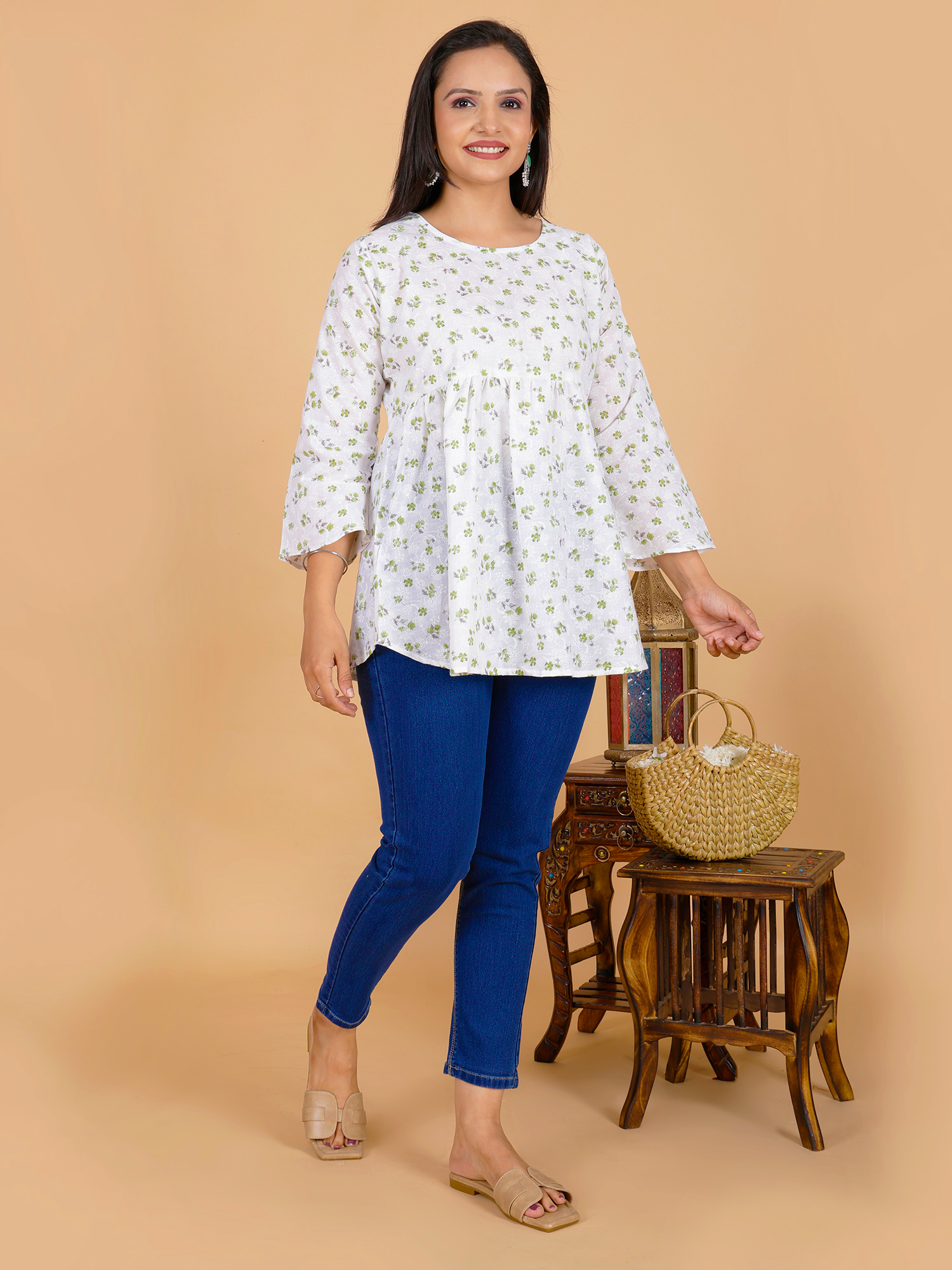 Women’s floral tunic dress in white with small green print, round neckline, 3/4 sleeves