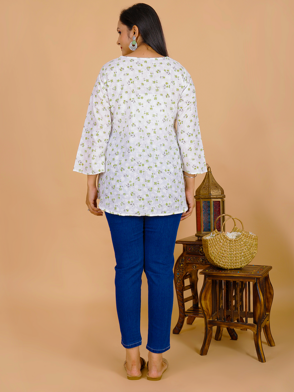 Floral tunic dress, white with small green print, back view, 3/4 sleeves