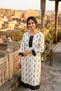 Women’s cotton kurti in off-white with dark motifs and black lace-trimmed front panel