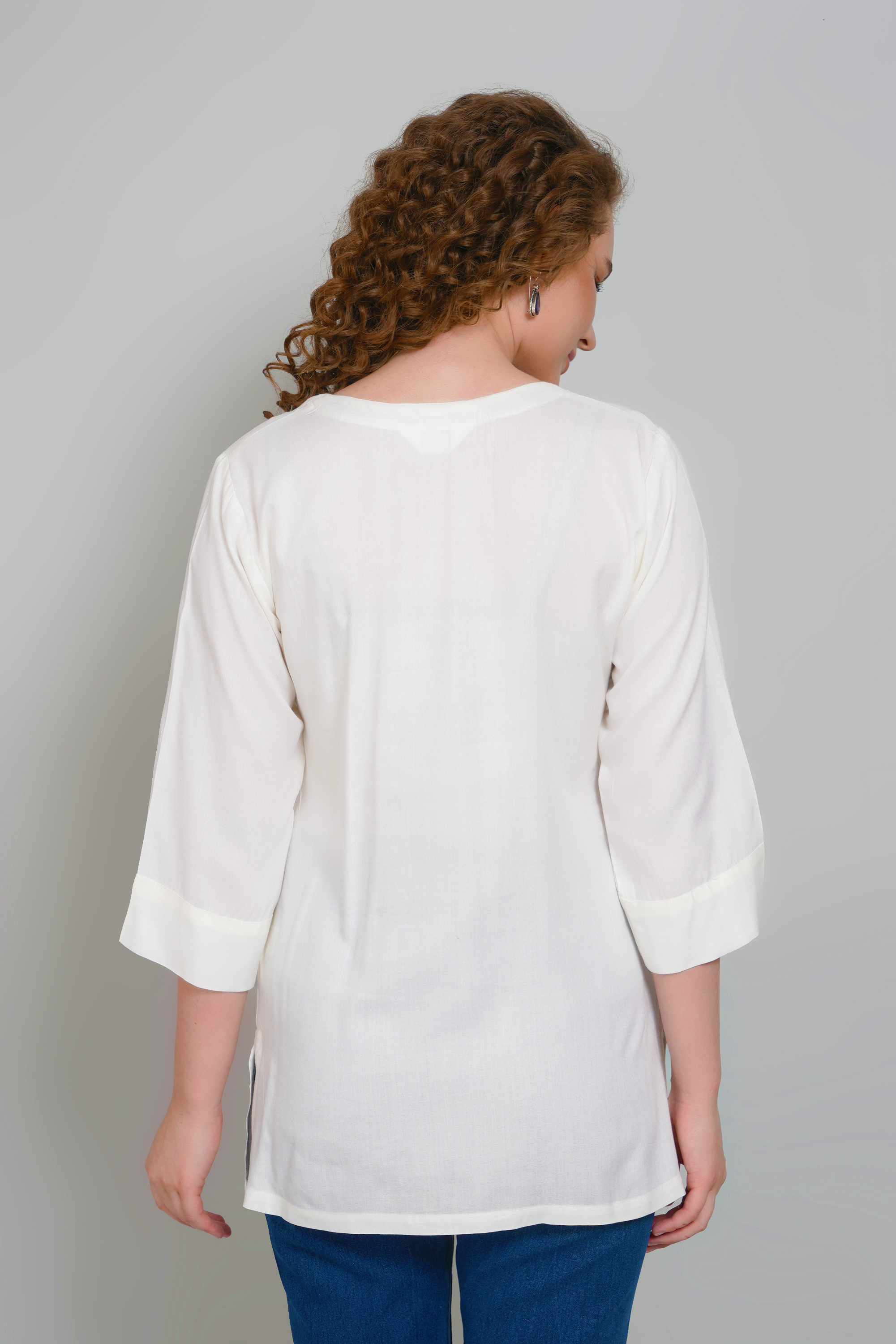 Women’s off-white tunic with 3/4 sleeves and back yoke seam detail