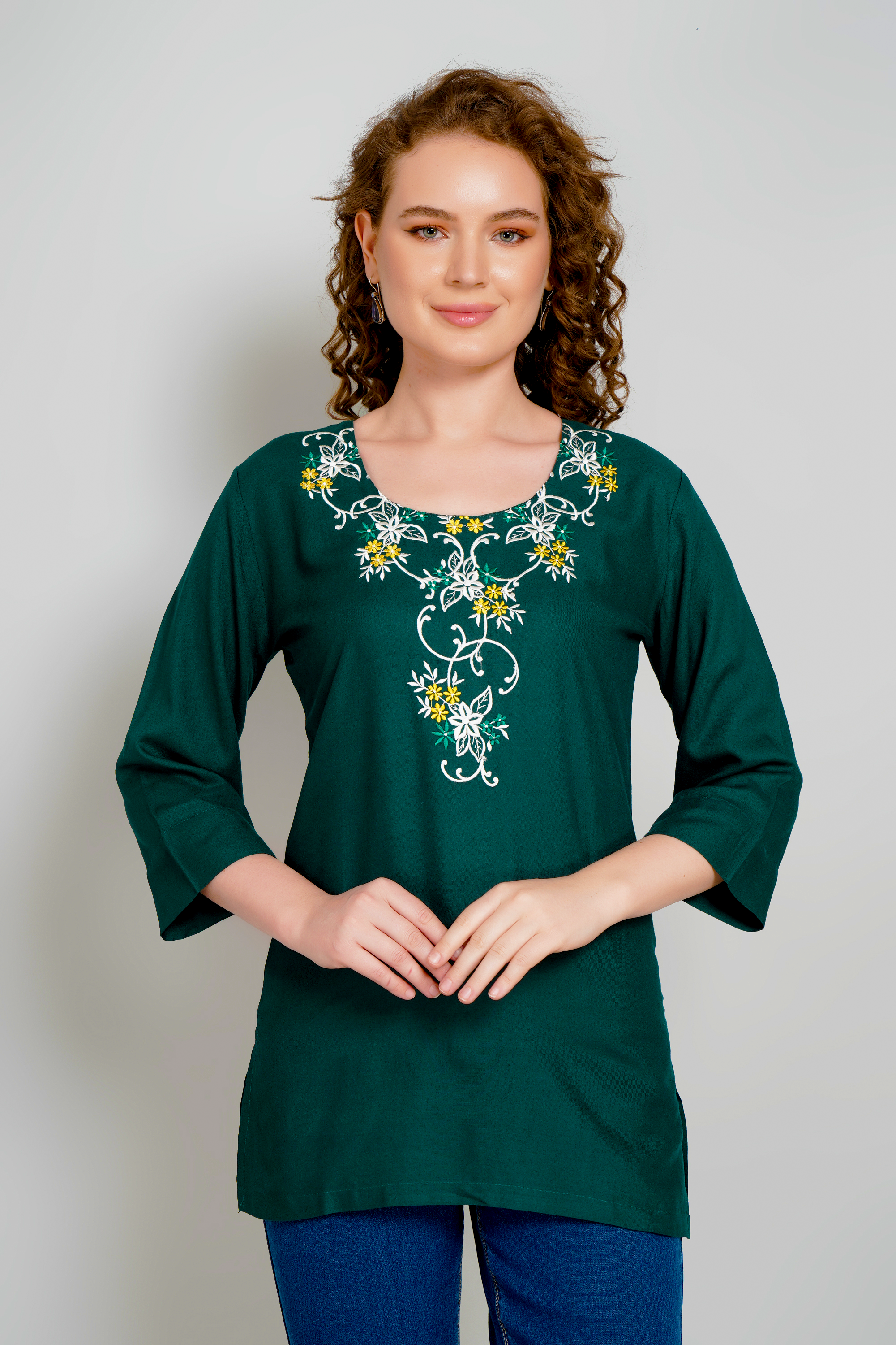 Dark green short kurti with gold floral neckline and chest embroidery