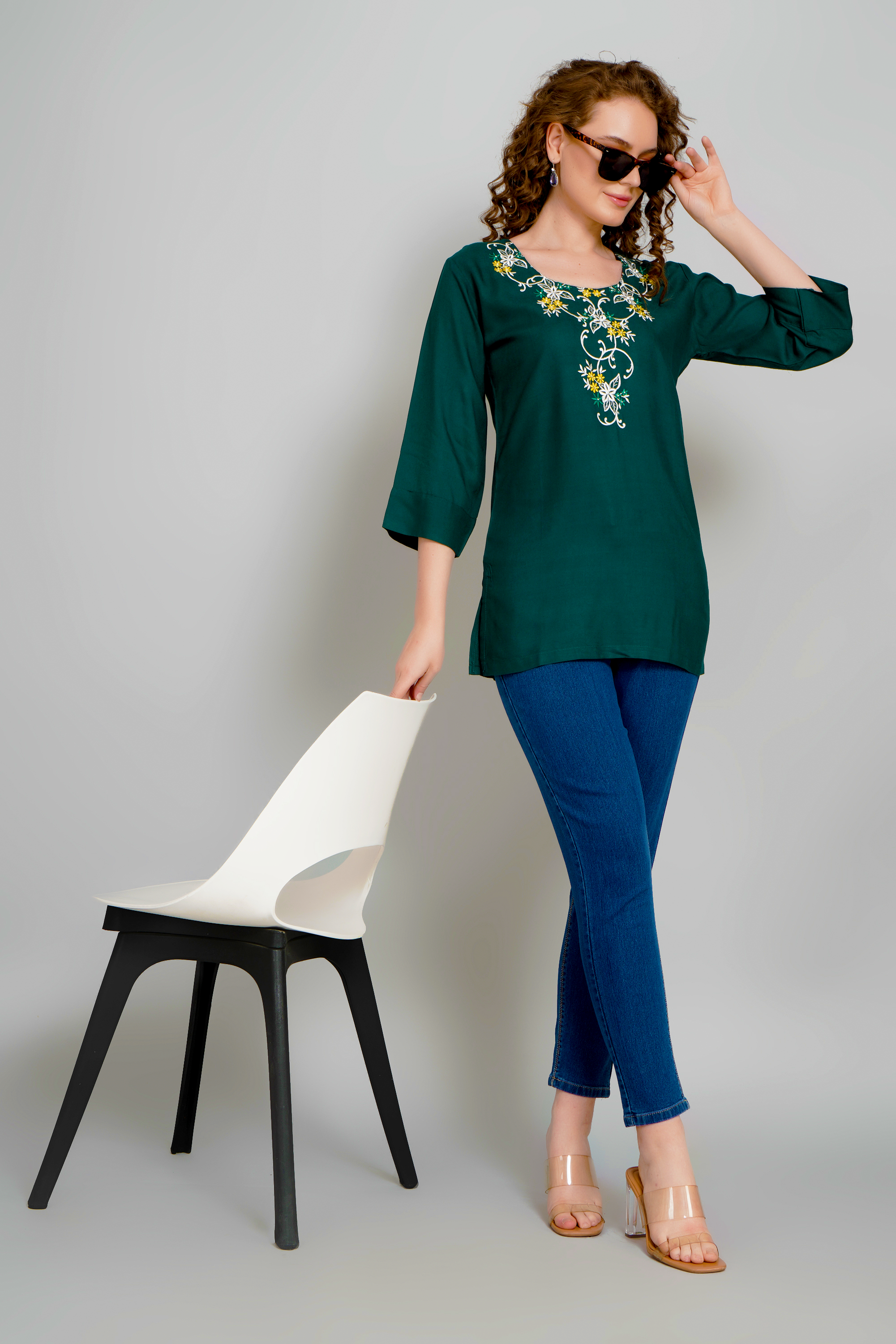 Dark green short kurti with gold floral chest embroidery and 3/4 sleeves