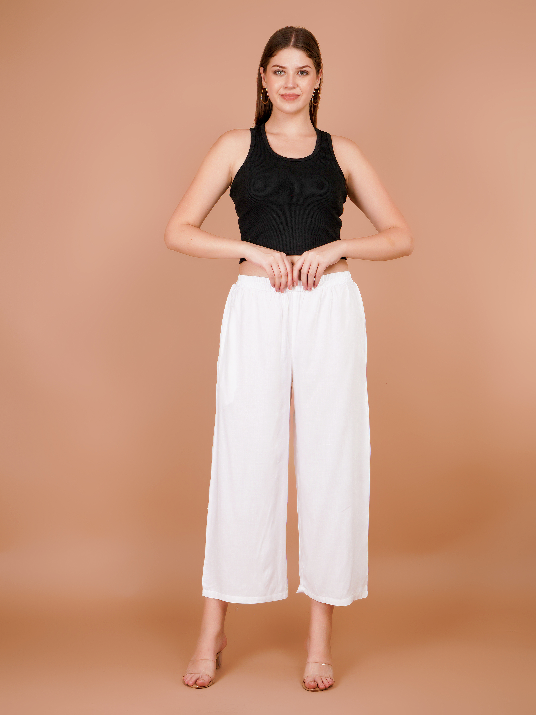 Women’s white palazzo pants with elastic waist and wide cropped legs