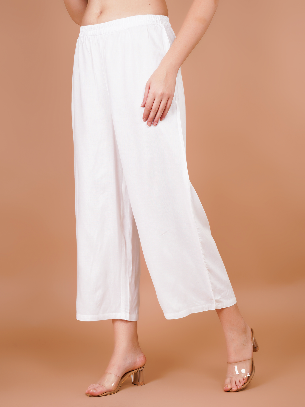 Women’s white palazzo pants with side pockets and flowy wide legs