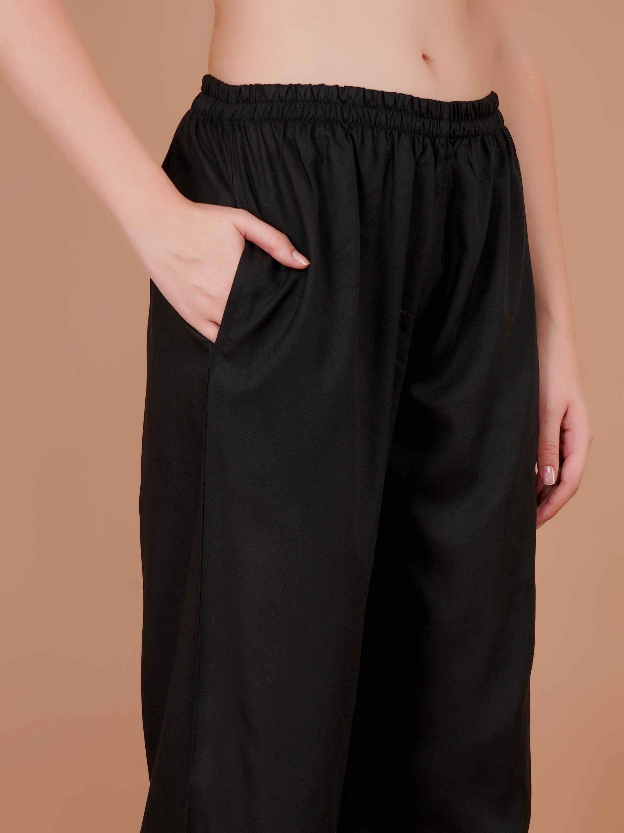 Women’s black palazzo pants with gathered elastic waist and loose wide fit