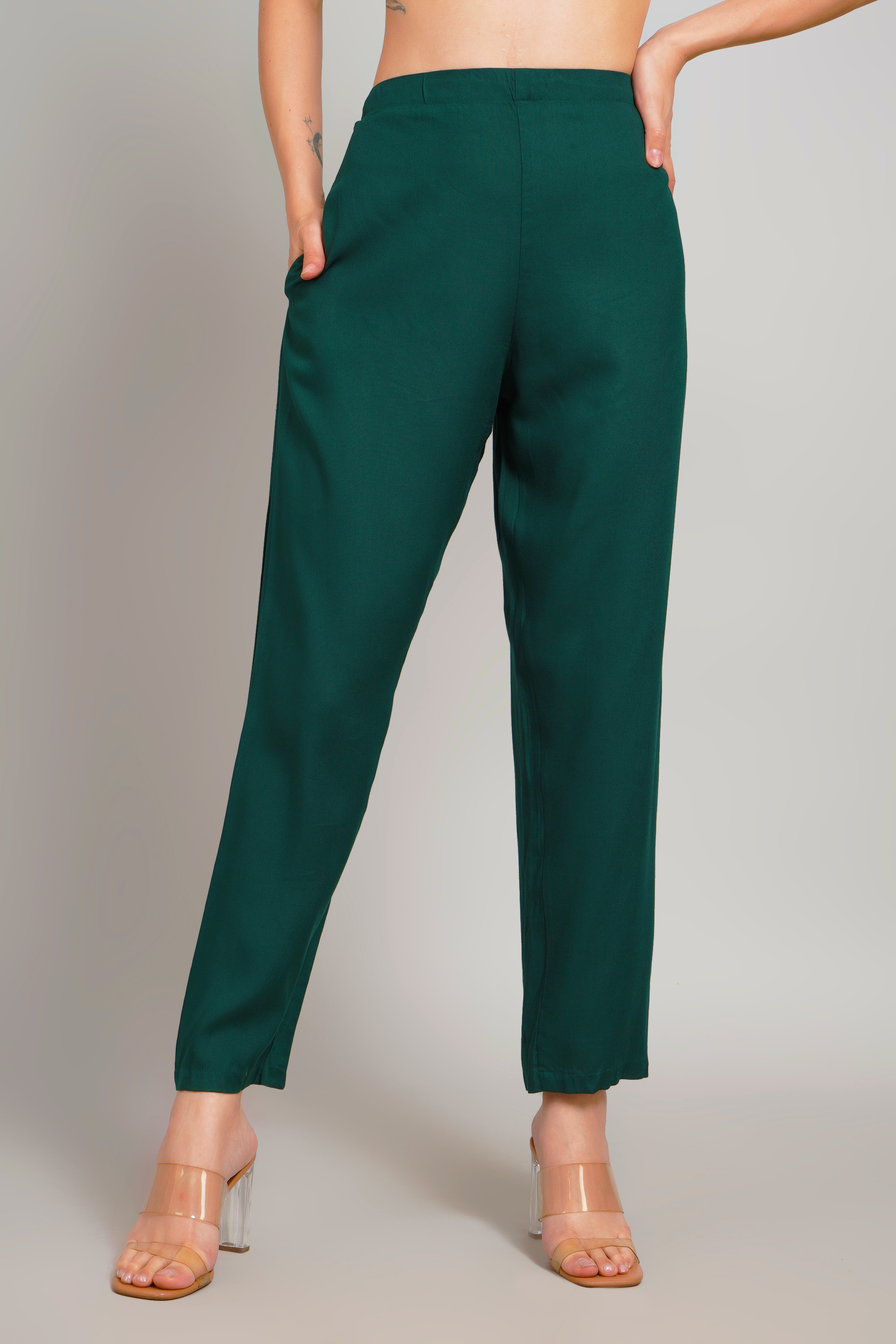 Women’s dark green trousers front view showing smooth straight leg fit