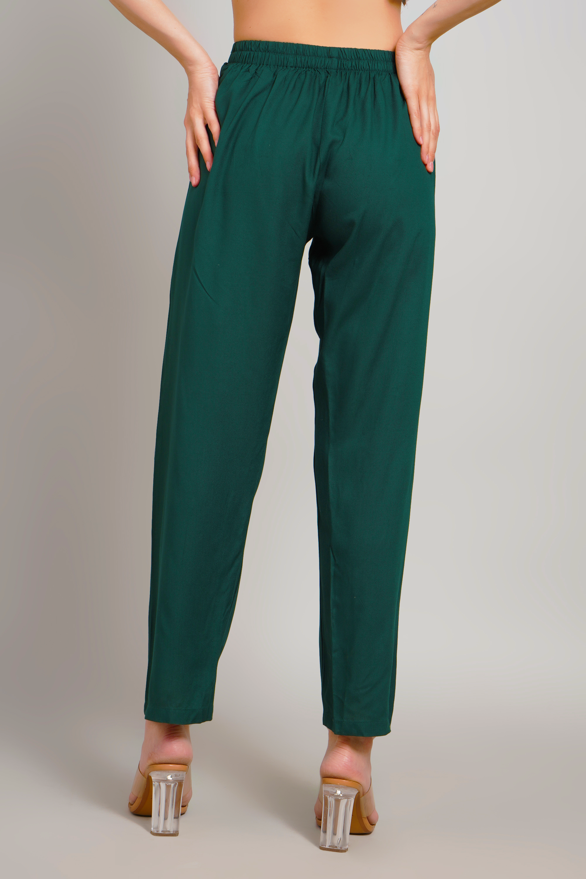 Women’s dark green pull-on trousers with elastic waistband and tapered ankle