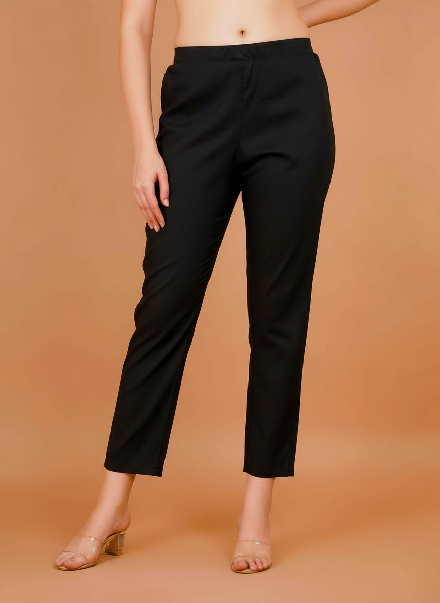 Women's black cropped trousers with straight tapered fit and elastic waist.