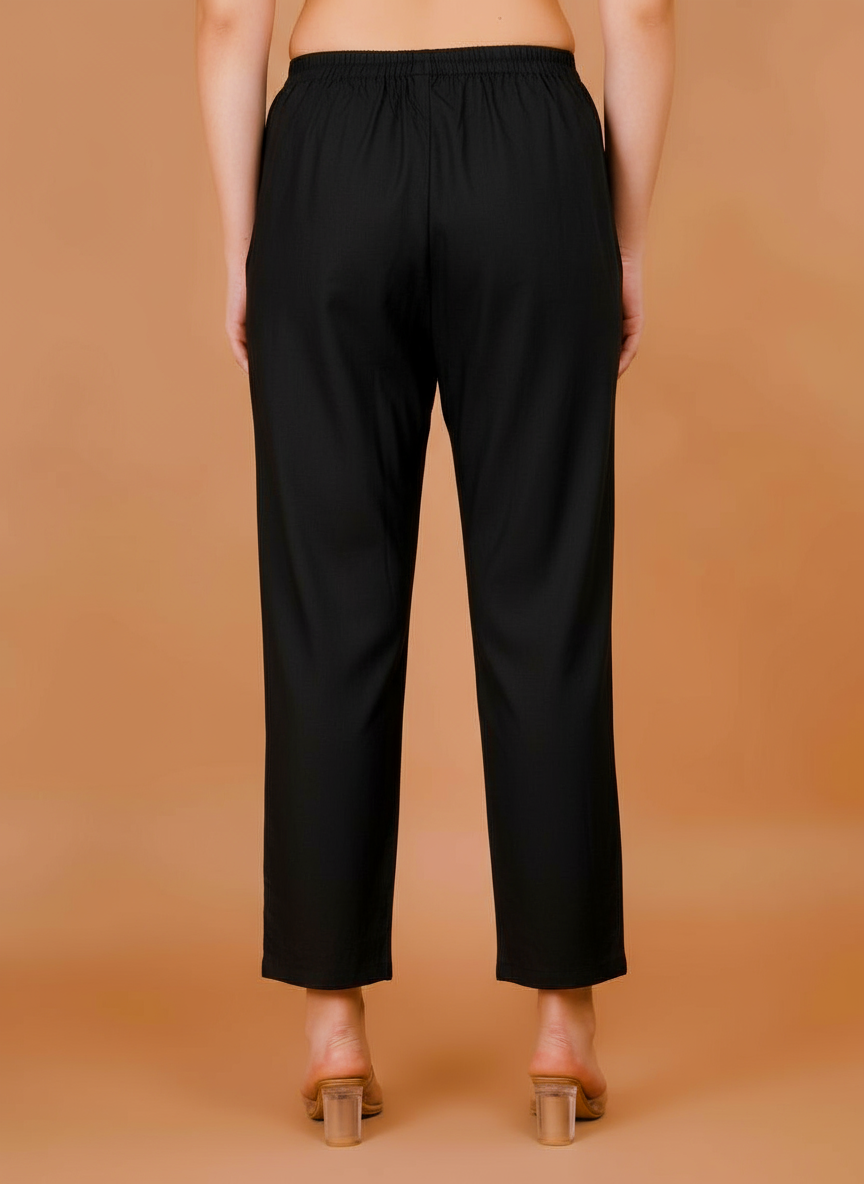 Women's black cropped trousers with elastic waist, tapered straight leg.