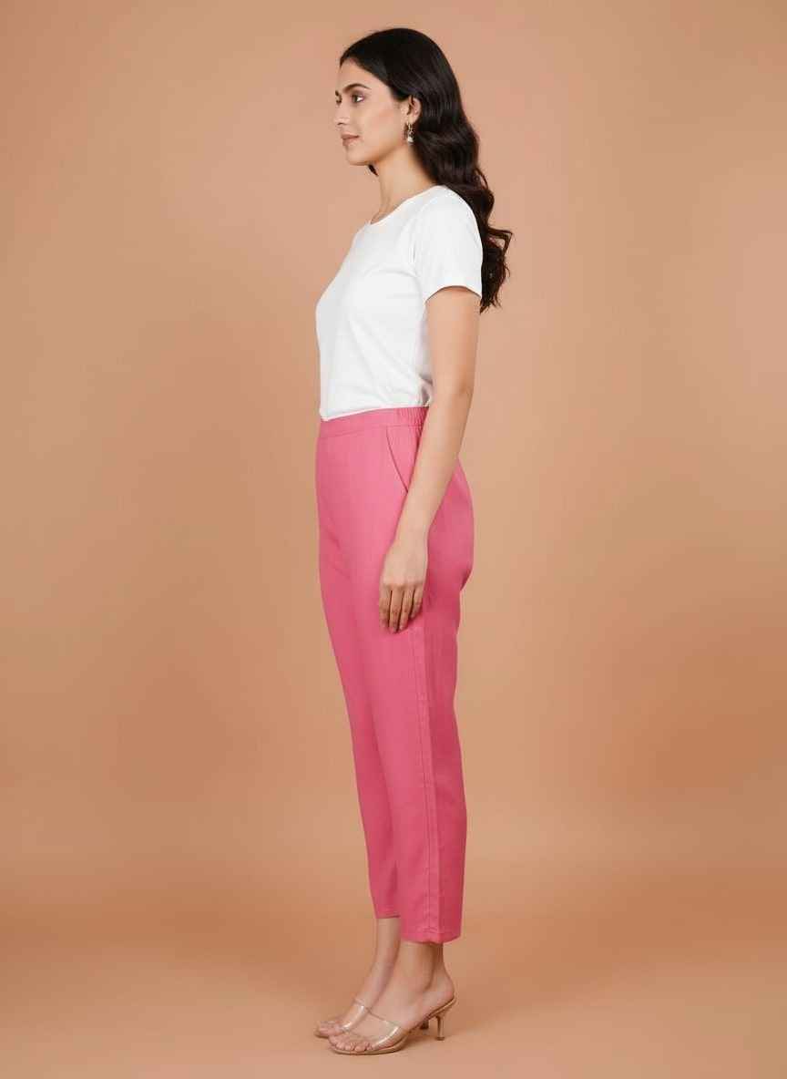 Women’s pink trousers viewed from the side, straight leg and ankle-length hem